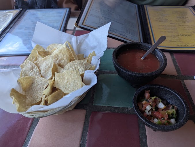 Chips with red salsa and pico de gallo