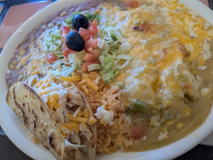 Cheese enchilada combination plate with rice and beans